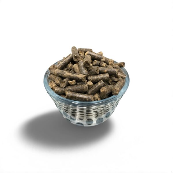 A glass bowl filled with compressed manure pellets, commonly used as a nutrient-rich substrate for mushroom cultivation and gardening.