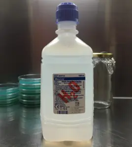Distilled water 1000ml bottle on a laboratory table, ideal for adding humidity to mushrooms and misting mushroom grow kits